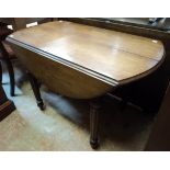 A 3' 3" 19th Century mahogany drop-leaf extending dining table, set on turned and reeded legs