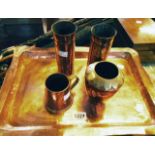 A copper tray - sold with a pair of copper vases, another vase and a small tankard
