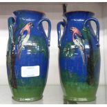 A pair of Torquay pottery parrot pattern tyg vases