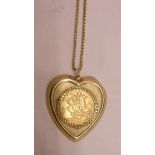 A 1908 Edward VII gold sovereign loose mounted in 9ct. gold heart shaped pendant on 9ct. chain