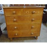 A 3' 2" modern waxed pine chest of two short and three long drawers, set on turned feet