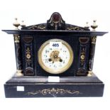 A late Victorian black slate, marble and gilt metal mounted ornate mantel clock of architectural