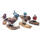 Seven late 20th Century highly detailed carved and painted wood models of small birds - indistinctly