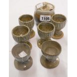 A Marianne de Trey studio pottery mustard pot - sold with a set of four egg cups and two others