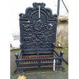 A Victorian cast iron fire back with Poseidon and merfolk decoration - sold with a heavy cast iron