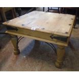 A 26" eastern hardwood coffee table with metal studded top, iron bound corners and brackets to