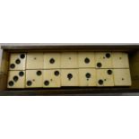 A complete set of antique bone and ebony six spot dominoes