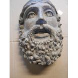 A precast composite mask of a bearded Classical male