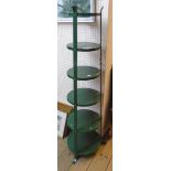 A green painted metal graduated six tier cooking pan stand