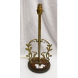A brass table lamp with foliate decoration