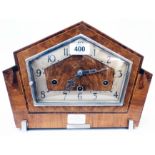 An Art Deco walnut and strung cased gable top mantel clock with Norland eight day chiming movement