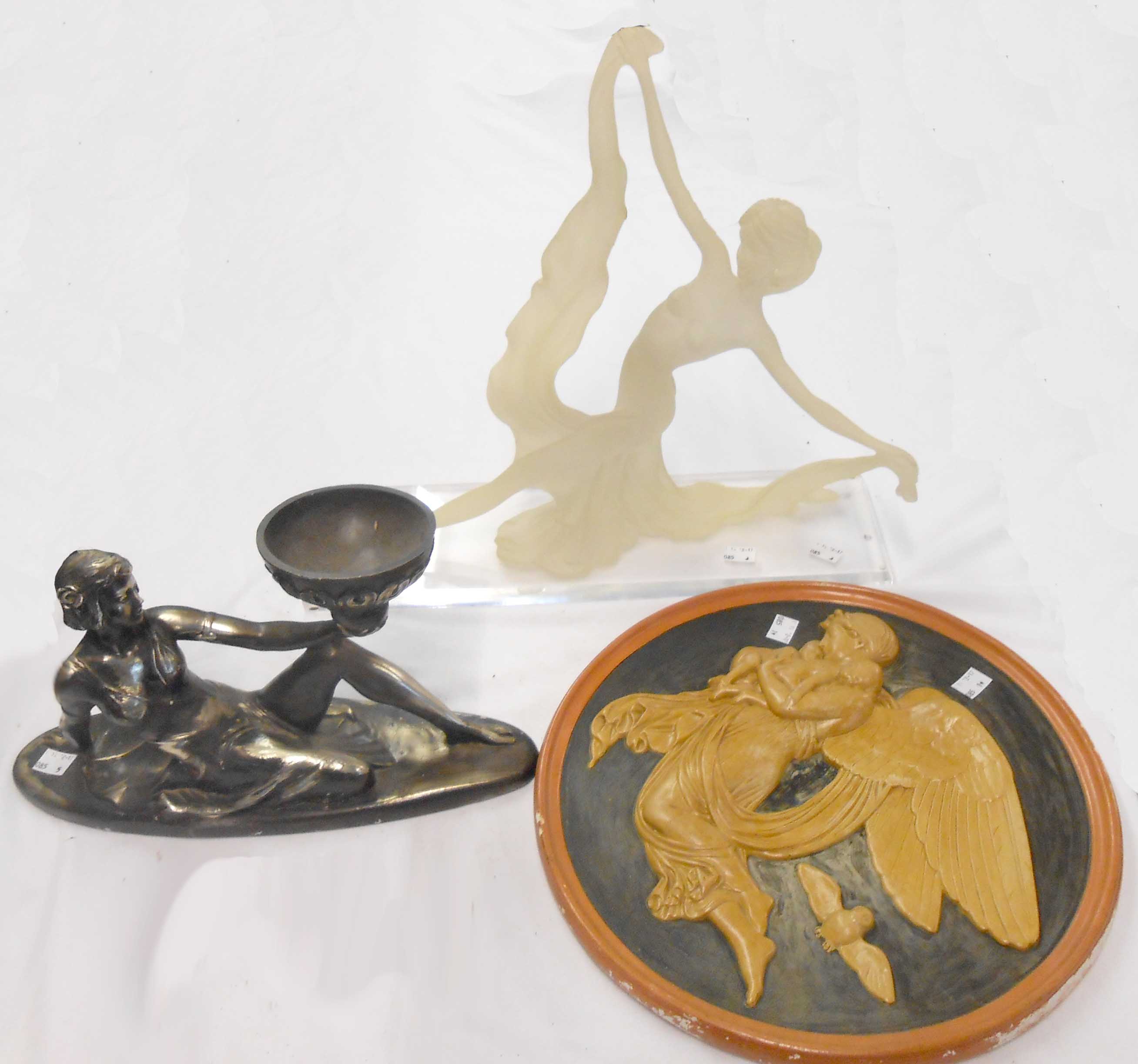 A plaster wall plaque with angel and owl decoration - sold with two resin Art Deco style figures (