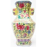 A 10 1/2" Chinese faceted baluster vase with enamelled millefiore on yellow ground