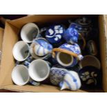 A box containing a quantity of blue and white ceramics including lidded trinket pots, miniature