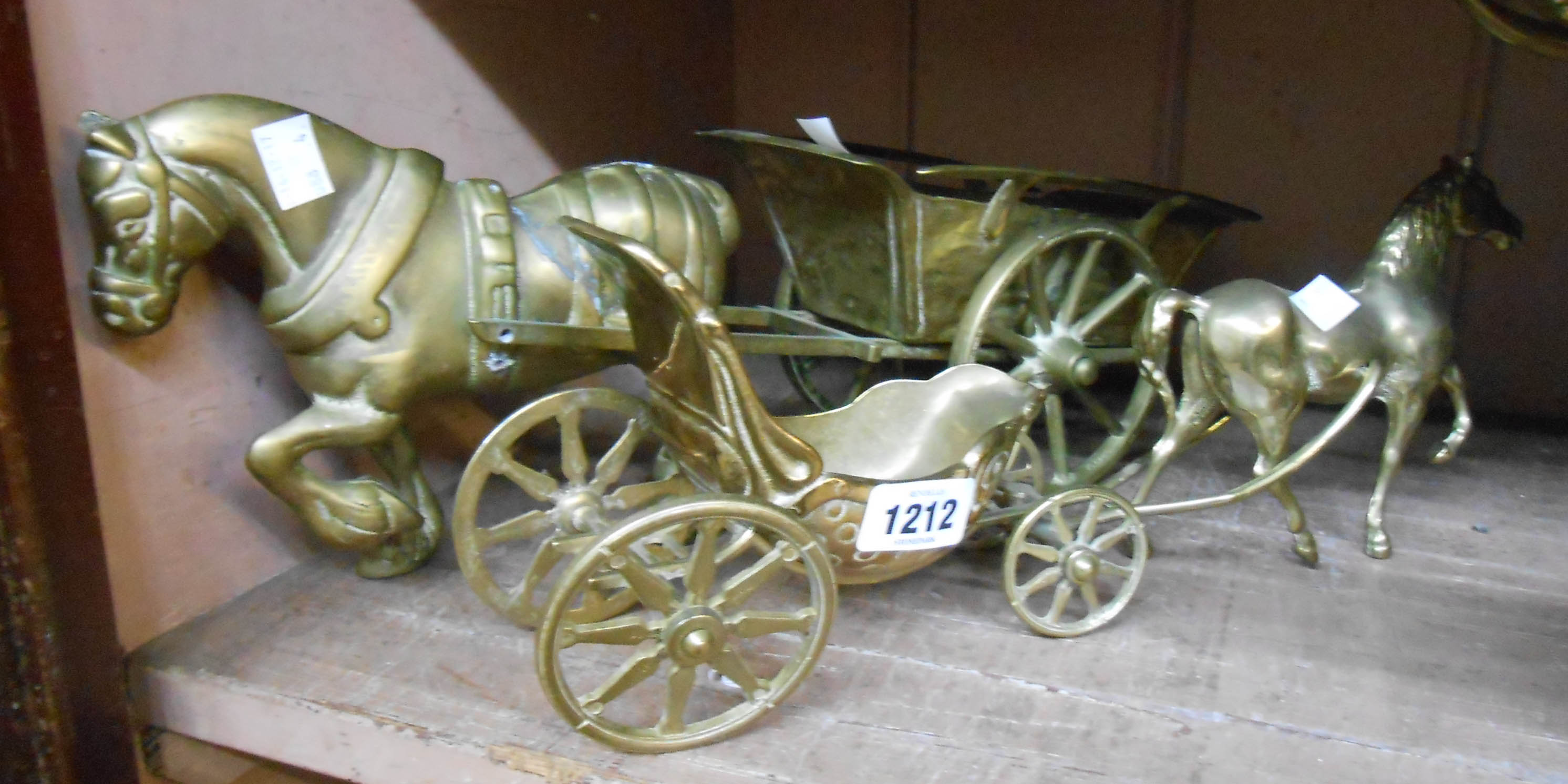 Two brass horses and carts