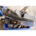 A crate containing various tools including large box plane, Stanley Bailey No. 7 plane, mallets,