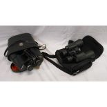Two cased pairs of binoculars, 8-24X50 and 10X50