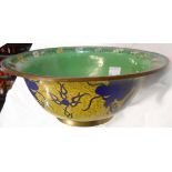 An 8 3/4" diameter cloisonné lipped bowl with floral border on green ground within a yellow exterior