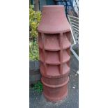 A 3' 3" terracotta chimney pot with vented sides