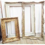 A large carved gilt picture frame - sold with two further frames