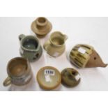 A small group of studio pottery including four jugs, hedgehog moneybox, etc.