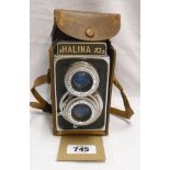 A Halina AI Anastigmat camera with 1:3.5 f=80mm lens