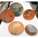 Five Torquay pottery terracotta plaques - various condition