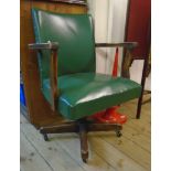 A 20th Century Abbess stained oak framed and green studded leatherette upholstered office swivel