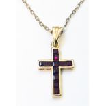 A 9ct. gold small cross, set with paved rubies on chain