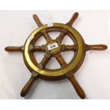 A 16" diameter stained wood and brass ship's wheel