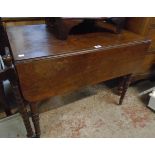 A 35 1/2" 19th Century mahogany Pembroke table with single drawer, set on ring turned legs with