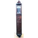 A maritime stained hardwood wall hanging corner barometer with anchor motif to door - 4' high -