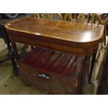 A 36" 19th Century mahogany cross banded and strung fold-over card table, set on turned legs