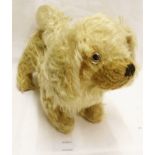 An early 20th Century straw filled toy dog