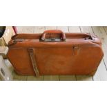 A vintage brown vinyl suitcase