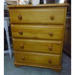 A 29 1/2" modern varnished pine chest of four long drawers, set on bracket feet