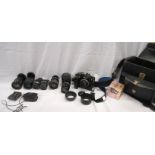 A cased Nikon FM2 35mm camera body with Nikon 50mm f1.8 lens - sold with six further lenses, Nikon