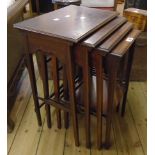 An Edwardian mahogany and strung quartetto set of nesting tea tables, set on slender square