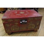 A 26" oriental red lacquered and parcel gilt decorated lift-top box with metal latch and