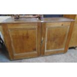 A 4' 3" antique waxed pine two door cupboard with later painted interior