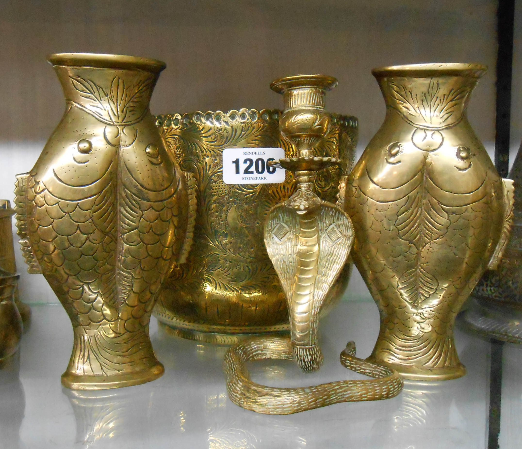 A pair of brass fish pattern vases - sold with an Eastern plant pot holder and a cobra pattern