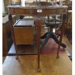 A 30" reproduction mahogany and strung demi-lune side table set on slender cabriole legs with pad