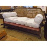 A 1920's walnut framed three piece Bergere suite, comprising 5' 6" three seater settee and pair of