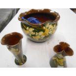 A Longpark Pottery jardinière with daffodil decoration - sold with two similar small vases (one a/