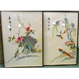 A pair of ebonised framed 20th Century Oriental silk embroidery pictures, depicting pheasants,