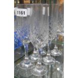 Six cut glass champagne flutes