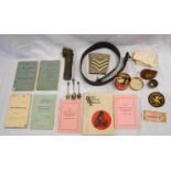 A collection of Post War British Army militaria including Infantry Training manuals, buttons,