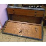 A 31" vintage ebonised wood and metal bound carpenter's chest with part fitted interior