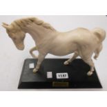 A Beswick bisque horse figure, Spirit of Freedom set on a plinth base - restored