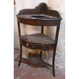 A 23" 19th Century mahogany and strung gentleman's corner washstand with shaped splash back, bowl